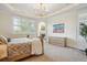 Sunlit bedroom with neutral colors, large windows, a fireplace, and light-colored wooden furniture at 8717 Ridgepoint Dr, Castle Pines, CO 80108