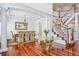 Elegant dining room with hardwood floors and staircase at 8717 Ridgepoint Dr, Castle Pines, CO 80108