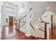 Bright foyer featuring staircase and hardwood flooring at 8717 Ridgepoint Dr, Castle Pines, CO 80108