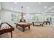 Expansive game room with a pool table, shuffleboard, foosball, and ping pong table at 8717 Ridgepoint Dr, Castle Pines, CO 80108