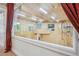 Large game room features basketball court, windows, and recessed lighting at 8717 Ridgepoint Dr, Castle Pines, CO 80108
