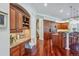 Bright kitchen area with cherry cabinets, granite counters, breakfast bar, stainless steel appliances, and a desk area at 8717 Ridgepoint Dr, Castle Pines, CO 80108