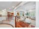 Open-concept living area with view of gourmet kitchen at 8717 Ridgepoint Dr, Castle Pines, CO 80108