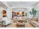 Spacious living room flowing into modern kitchen at 8717 Ridgepoint Dr, Castle Pines, CO 80108