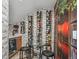 Unique wine cellar featuring brick walls and wine racks, a tasting table, and a wine refrigerator at 8717 Ridgepoint Dr, Castle Pines, CO 80108