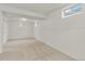 Finished basement area with carpet, white walls, and natural light from windows at 1327 E 108Th Pl, Northglenn, CO 80233