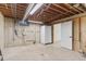Unfinished basement with exposed pipes, concrete walls and ceiling, and storage area at 1327 E 108Th Pl, Northglenn, CO 80233
