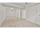 Finished basement featuring neutral carpet, white walls, window, and closet doors at 1327 E 108Th Pl, Northglenn, CO 80233