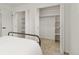 This bedroom features closet with sliding doors and open shelving for ample storage at 1327 E 108Th Pl, Northglenn, CO 80233