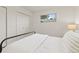 Bedroom features a white closet and an eye-level window at 1327 E 108Th Pl, Northglenn, CO 80233