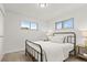 Bedroom with natural light features neutral colors, metal frame bed and carpeted floors at 1327 E 108Th Pl, Northglenn, CO 80233