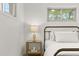 A cozy bedroom with an accent bedside table, complete with lamp and decor at 1327 E 108Th Pl, Northglenn, CO 80233