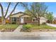 Well-maintained brick home featuring a tidy front lawn, landscaped garden beds, and a welcoming entrance at 1327 E 108Th Pl, Northglenn, CO 80233