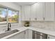 Bright kitchen features stainless steel sink, quartz countertops, and shaker-style cabinets at 1327 E 108Th Pl, Northglenn, CO 80233