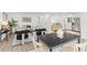 Open-concept living room and dining area features modern furnishings and ample natural light at 1327 E 108Th Pl, Northglenn, CO 80233