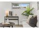 Cozy living room with modern decor, a comfortable couch, and stylish accents at 1327 E 108Th Pl, Northglenn, CO 80233