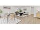 Stylish living and dining area with modern decor and light wood flooring at 1327 E 108Th Pl, Northglenn, CO 80233