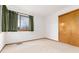 Cozy bedroom with a closet and large window, creating a serene and inviting space at 15565 Flowerhill Cir, Parker, CO 80134
