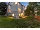 Charming two-story home featuring a combination of siding and brick, nestled on a well-maintained lawn at 15565 Flowerhill Cir, Parker, CO 80134