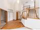 Bright foyer featuring hardwood floors, a staircase, and soaring ceilings at 15565 Flowerhill Cir, Parker, CO 80134