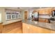 Open concept kitchen features a kitchen island with granite countertops and stainless steel appliances at 15565 Flowerhill Cir, Parker, CO 80134