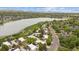 Scenic aerial view of the neighborhood highlighting the adjacent lake and mountain backdrop at 1799 S Lee St # B, Lakewood, CO 80232