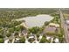 Panoramic aerial view of the area featuring lake access, tree-lined streets, and nearby amenities at 1799 S Lee St # B, Lakewood, CO 80232