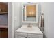 This half bathroom features a modern sink and vanity with a mirror and neutral paint at 1799 S Lee St # B, Lakewood, CO 80232