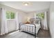 Bright and airy bedroom with two windows, neutral paint, and ample natural light at 1799 S Lee St # B, Lakewood, CO 80232
