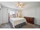 Cozy bedroom features a comfortable bed, dresser, and a ceiling fan for added comfort at 1799 S Lee St # B, Lakewood, CO 80232