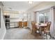 Well-lit kitchen with stainless steel appliances, ample cabinet space, and a dining area near the window at 1799 S Lee St # B, Lakewood, CO 80232