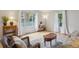 Bright living room featuring hardwood floors, comfortable seating, and a large window for natural light at 1799 S Lee St # B, Lakewood, CO 80232