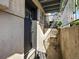 Private patio with black door and small chair at 9250 E Girard Ave # 8, Denver, CO 80231