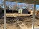 Wide backyard featuring a large shed, fencing, and pathway, perfect for outdoor enjoyment at 1263 N Willow St, Denver, CO 80220