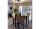 Inviting dining area with sliding glass doors to the backyard, adjacent to a modern kitchen at 1263 N Willow St, Denver, CO 80220