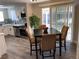 Charming dining area with seating for four, adjacent to a modern kitchen at 1263 N Willow St, Denver, CO 80220