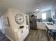 Bright kitchen with stainless steel appliances, white cabinets, and modern countertops at 1263 N Willow St, Denver, CO 80220