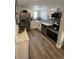 Well-lit kitchen with stainless steel appliances, quartz counters, and gray subway tile backsplash at 1263 N Willow St, Denver, CO 80220