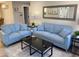 Comfortable living room featuring a modern gray rug and comfortable seating at 1263 N Willow St, Denver, CO 80220