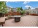 This backyard offers a wooden deck, fire pit, landscaping, and a pergola, perfect for outdoor enjoyment at 3389 Willowrun Dr, Castle Rock, CO 80109