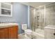 This full bathroom features modern updates, a glass shower and neutral wall paint, creating a serene space at 3389 Willowrun Dr, Castle Rock, CO 80109