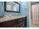 Bathroom showcasing double vessel sinks, granite countertops, and modern fixtures at 3389 Willowrun Dr, Castle Rock, CO 80109