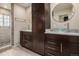 Bathroom with a double vanity, vessel sinks, and a tiled walk-in shower at 3389 Willowrun Dr, Castle Rock, CO 80109