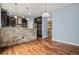 Modern kitchen showcasing dark cabinets, granite counters, and stainless steel appliances at 3389 Willowrun Dr, Castle Rock, CO 80109