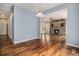 Hardwood floors connect rooms, highlighting a living room with a stone fireplace at 3389 Willowrun Dr, Castle Rock, CO 80109