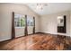 Bright main bedroom featuring vaulted ceilings, hardwood floors, and ensuite bathroom at 3389 Willowrun Dr, Castle Rock, CO 80109