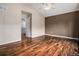 Spacious main bedroom featuring a vaulted ceiling, ceiling fan, and gleaming hardwood floors at 3389 Willowrun Dr, Castle Rock, CO 80109