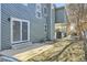 This backyard features a patio, sliding glass door, and interesting architectural details at 6491 Barnacle Ct, Boulder, CO 80301