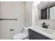 Modern bathroom featuring a stylish sink, toilet, and towel bar at 6491 Barnacle Ct, Boulder, CO 80301