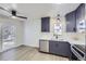 Lovely kitchen with brand new appliances, gray cabinets, stainless steel dishwasher and a double sink at 6491 Barnacle Ct, Boulder, CO 80301